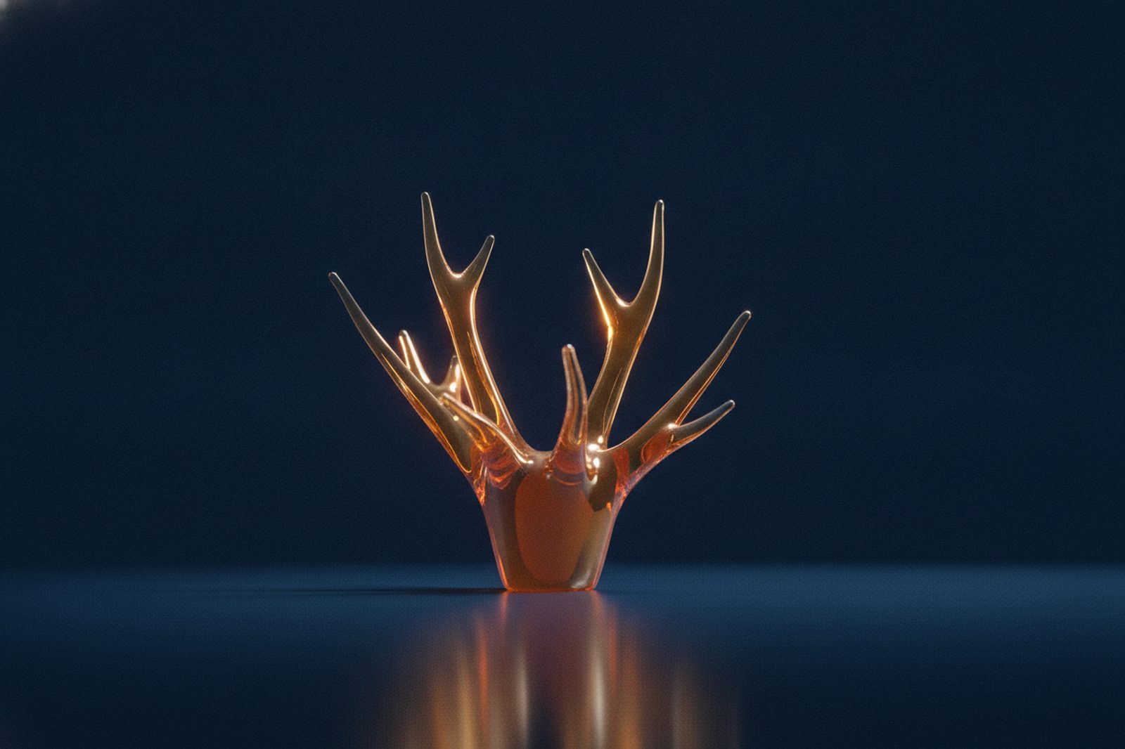 Amber glass antler sculpture on navy